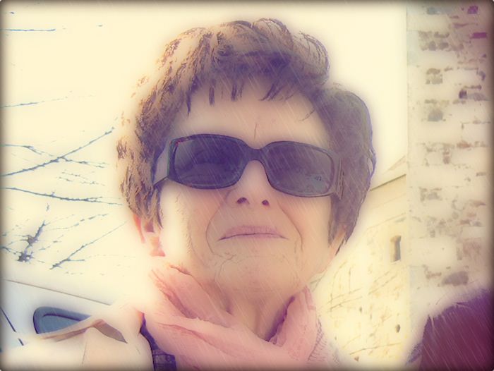 A portrait of the author's grandmother wearing sunglasses and looking cool