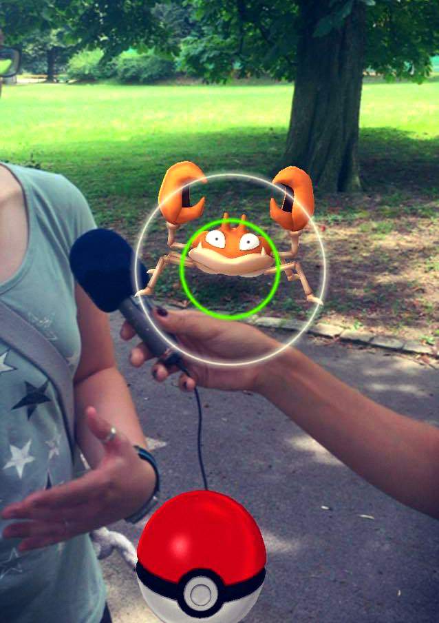 A screenshot showing the Pokemon GO UI with the author being interviewed in the background.
